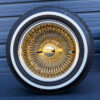 14x7-gold-center-wire-wheels-and-whitewall-tires-front-view Gold center front view mounted on whitewall tire