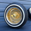 14x7-gold-center-wire-wheels-and-whitewall-tires-side-view gold center with 2-bar knock-off mounted on whitewall tires
