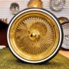 22-inch-standard-wire-wheels-all-gold-24kt-255-30-r22-custom-whitewall-tires-front-view 22×8″ All Gold Wire Wheels – 150 Spoke Standard + 255/30R22 Custom Whitewall Tires (Set of 4)