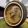 22x8” Gold Wire Wheels – 150 Spoke All Gold + Knock-Off Eagle Chip + 265/35R22 Vogue Tires - side angle