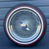 17x8-inch-wire-wheels-standard-chrome-with-whitewall-and-red-stripe-tires 17x8" Wire wheels chrome standard 100 Spoke + whitewall and red stripe tires - side view