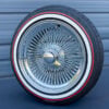 17x8-inch-wire-wheels-standard-chrome-with-whitewall-and-red-stripe-tires-side-2 100 spoke wire wheel mounted on a red stripe tire