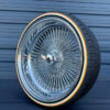 24x10" wire wheels deep dish reverse offset with 255/30R24 custom whitewall and gold stripe tires