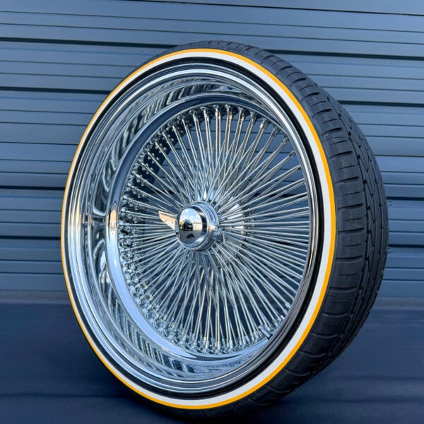 24x10" wire wheels deep dish reverse offset with 255/30R24 custom whitewall and gold stripe tires