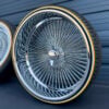 26" wire wheels deep dish reverse offset chrome with 275/25R26 custom whitewall and yellow stripe tires