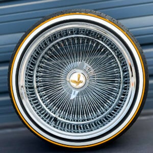 17x9-reverse-chrome-wire-wheels-100-spoke-with-whitewall-gold-stripe-tires-with-gold-eagle-chip 17x9 reverse chrome 100 spoke wire wheel front view with true whitewall tire and gold stripe
