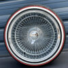 17x9-reverse-chrome-wire-wheels-100-spoke-with-whitewall-red-stripe-tires Custom wire wheel knock off spinner cap featuring 2-bar triple shine chrome.