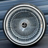 17x9-reverse-chrome-wire-wheels-100-spoke-with-whitewall-tires-with-black-eagle Custom wire wheel knock off spinner cap featuring black eagle center emblem chip
