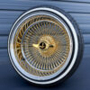 17x9-reverse-gold-center-100-spoke-wire-wheels-with-205-45-17-custom-true-whitewall-tires-black-and-gold-eagle-chip 17x9 reverse gold center 100 spoke wire wheel with black and gold eagle metal chip