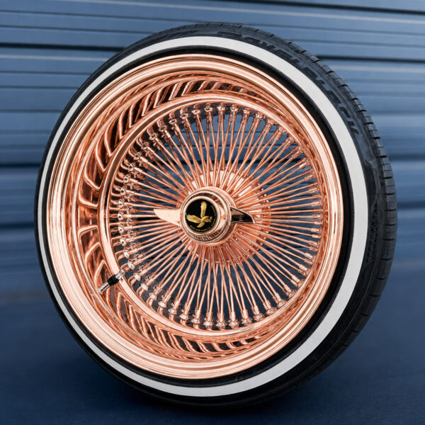 17x9-reverse-rose-gold-100-spoke-wire-wheels-with-205-45-17-custom-true-whitewall-tires-black-and-gold-eagle-chip 17x9 rose gold wire wheel reverse with 2-bar knock-off and black eagle metal chip