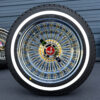 13x7-chrome-and-gold-spoke-and-chrome-lip-wire-wheel-whitewall-tire-set-red-eagle 13x7 Reverse Gold & Chrome 100-Spoke Wire Wheels + Whitewall Tires – ShowTime Hub