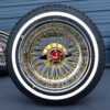 13x7-triple-gold-reverse-72-spoke-cross-lace-cali-spoke-diamond-cut-and-whitewall-tire-set-red-zenith-chip 13x7 reverse triple gold wire wheels 72 cross lace with 2-bar knock-off