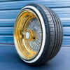 17x9-reverse-gold-lip-diamond-cut-spoke-wire-wheels-100-spoke-with-whitewall-tires-side-view 17x9 reverse chrome wire wheels with gold lip and chrome spoke