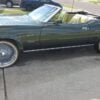 Side view of 1973 Mercury Cougar XR-7 with 20-inch chrome wire wheels
