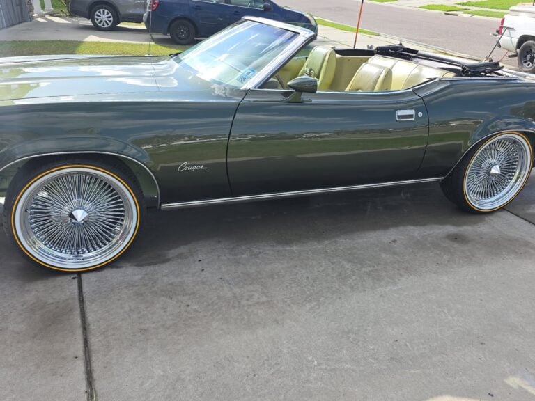 Side view of 1973 Mercury Cougar XR-7 with 20-inch chrome wire wheels