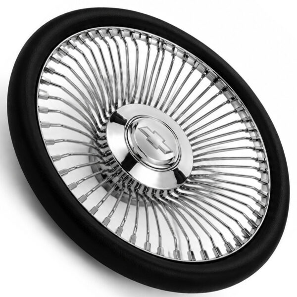 chevy-chrome-spoke-steering-wheel-black-grip-angle-view Angled view of Chevrolet 64-spoke chrome wire steering wheel showing engraved bowtie emblem and polished spokes