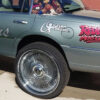 2006 Lincoln Town Car with 26-inch wire wheels and Lincoln floating caps